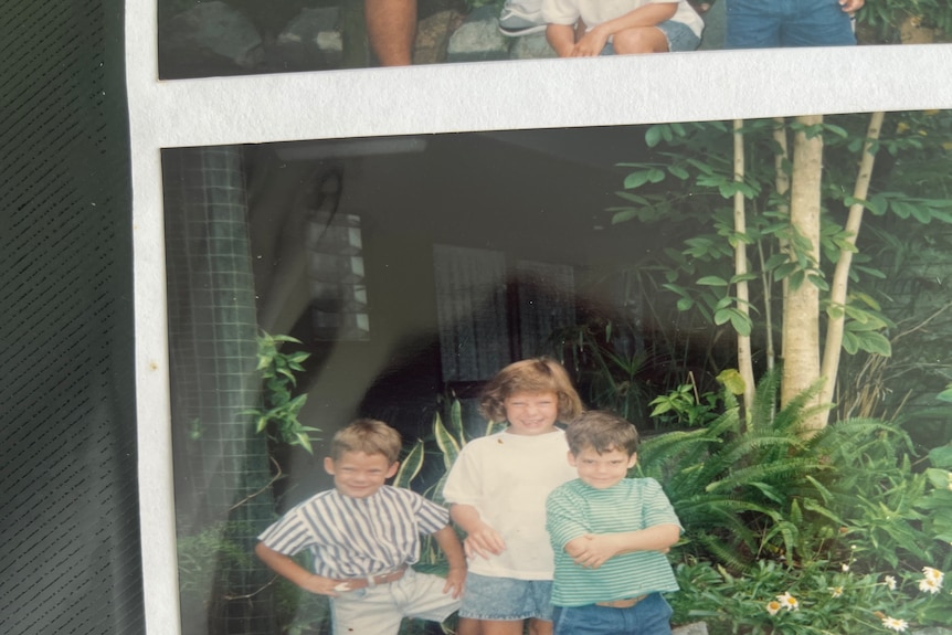 A photo of three children 