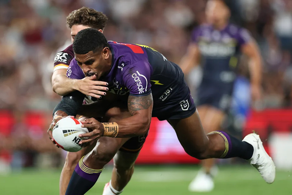 Seen here, Melbourne Storm forward Tui Kamikamica lunges for the try line during the 2025 NRL grand final against the Brisbane Broncos.