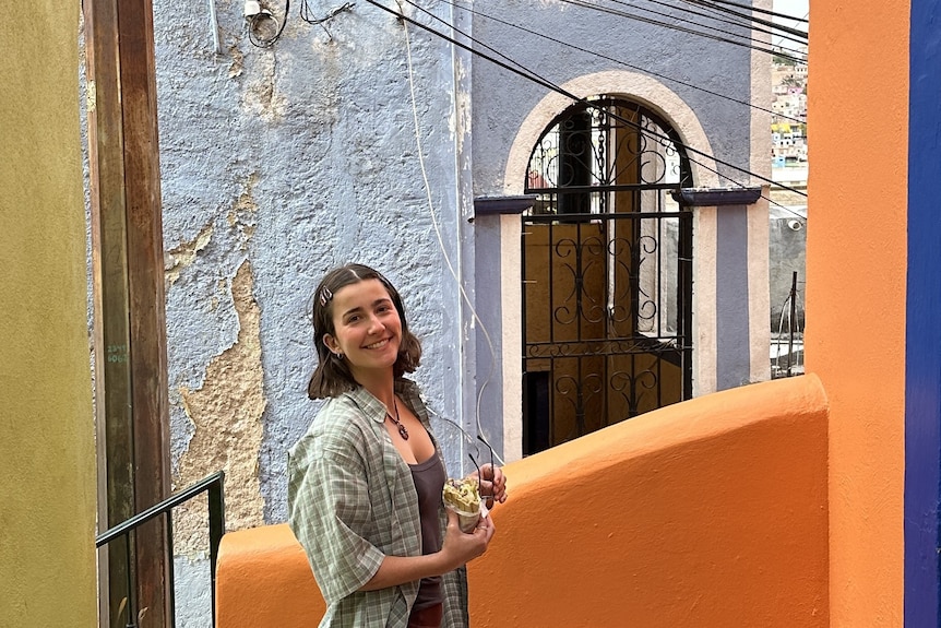 Claudia Lee smiling in a travel photo