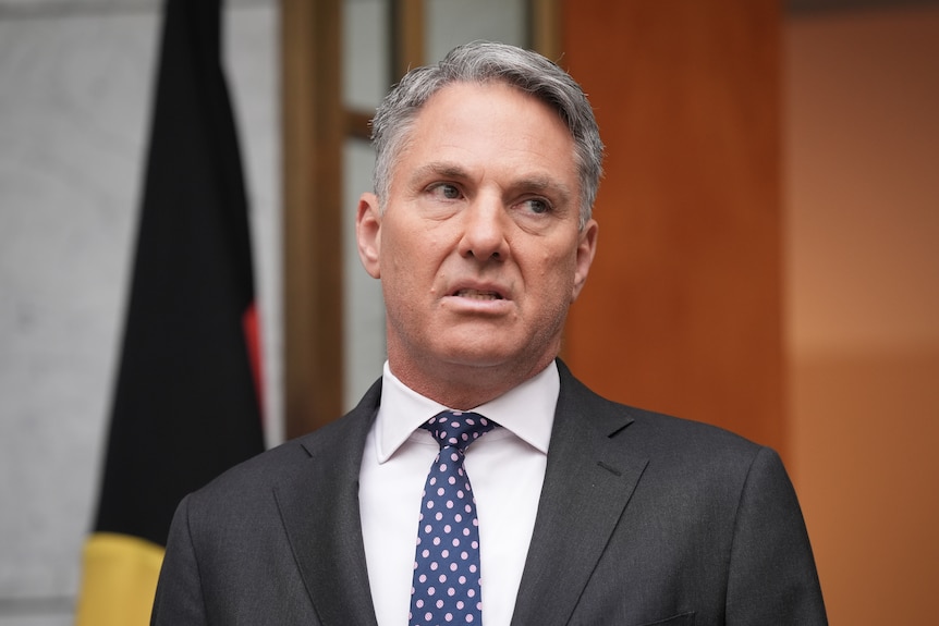 Close up of Richard Marles wearing a suit and tie. 