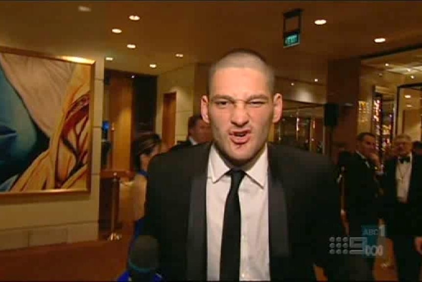 Brendan Fevola at a press conference with Michael Voss