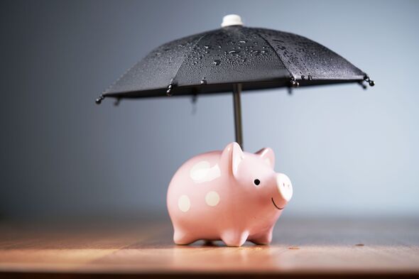 Close-up of umbrella on table against gray background