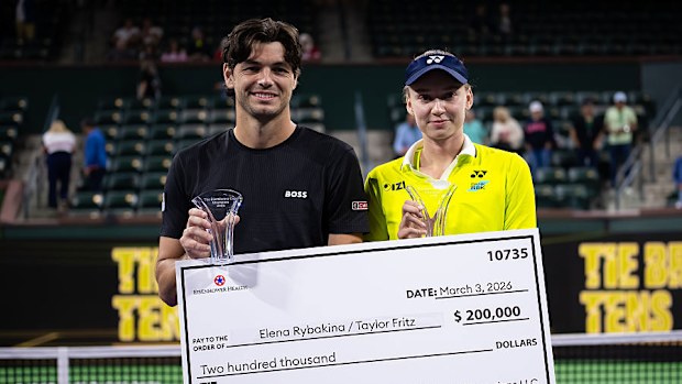 Taylor Fritz and Elena Rybakina pose with their trophies after winning the Eisenhower Cup Tie Break Tens.