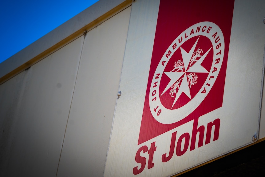 Circular ambulance logo on top of building 
