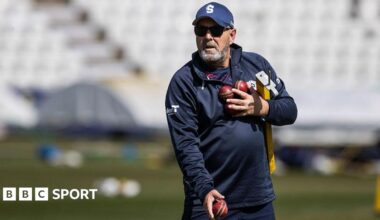 Darren Lehmann prepares to catch a cricket ball while wearing a baseball mitt