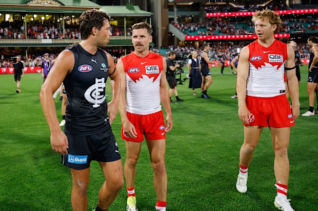 Oliver Florent of the Blues and Callum Mills of the Swans exchange words.