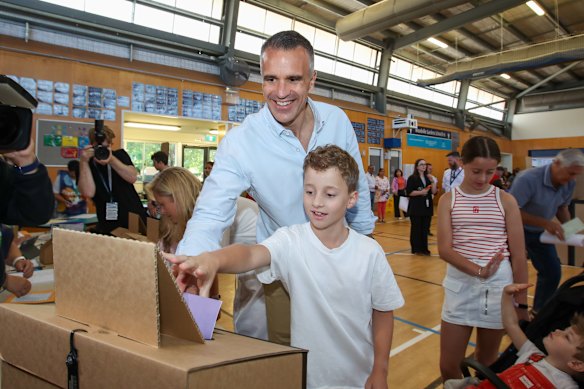 SA Premier Peter Malinauskas voting with his family at Woodville Gardens School in Adelaide on Saturday..