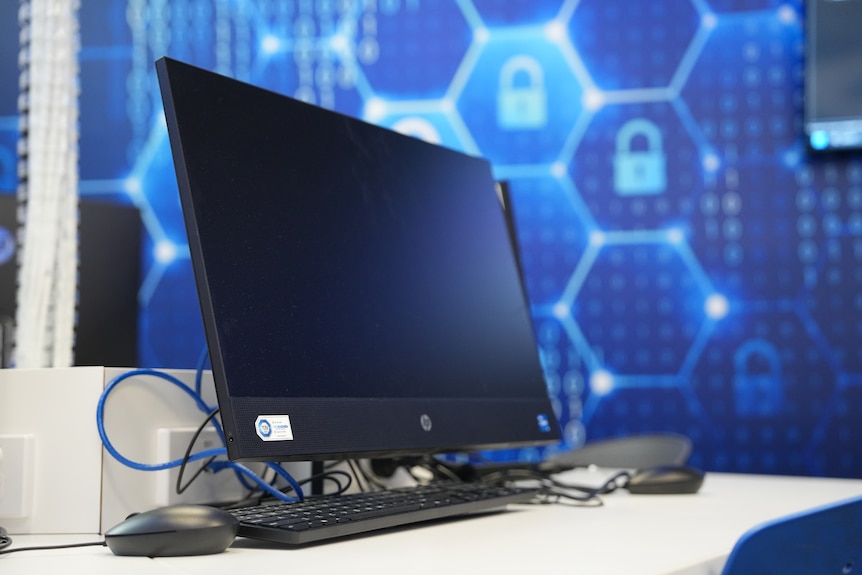Monitors displaying global cyber threats