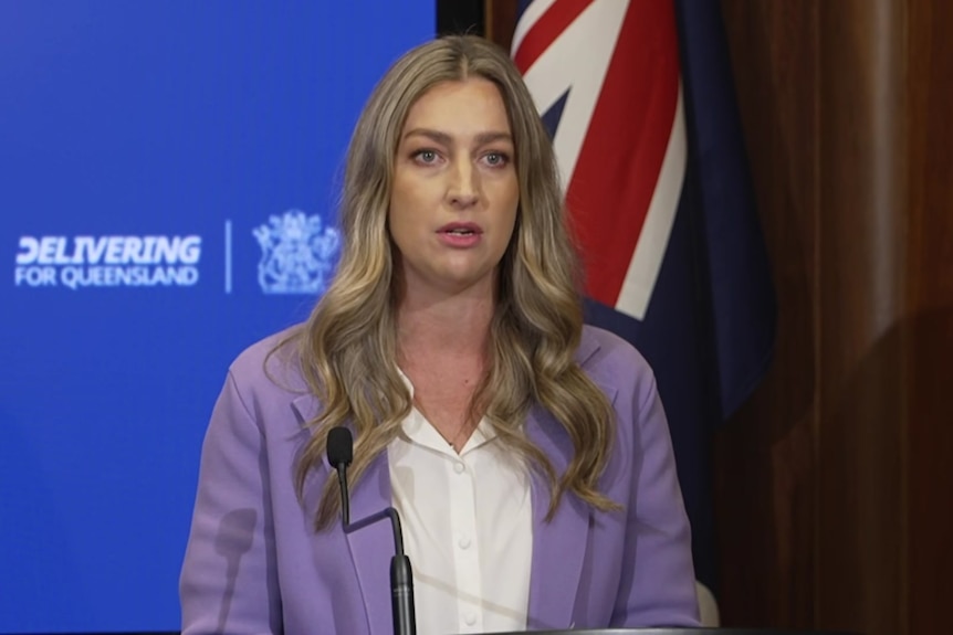Laura Gerber speaking at a lectern. 