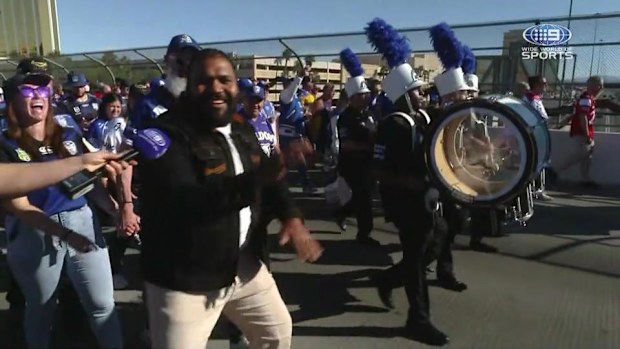 Sam Thaiday walks the bridge to Allegiant Stadium alongside Bulldogs fans.