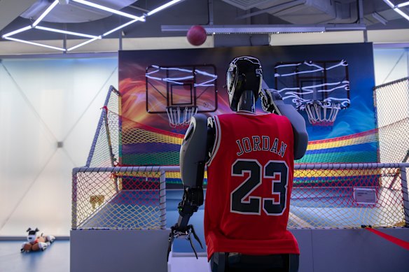 A robot shoots hoops.