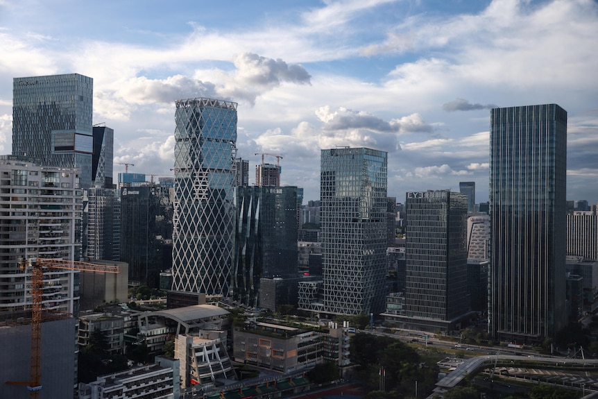 Glass and steel skyline view of Shenzhen's skyscrapers where Tencent is headquartered.