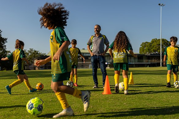 Sylvania Heights Football Club coach Aiman Gouda, pictured alongside young members of the grassroots club.