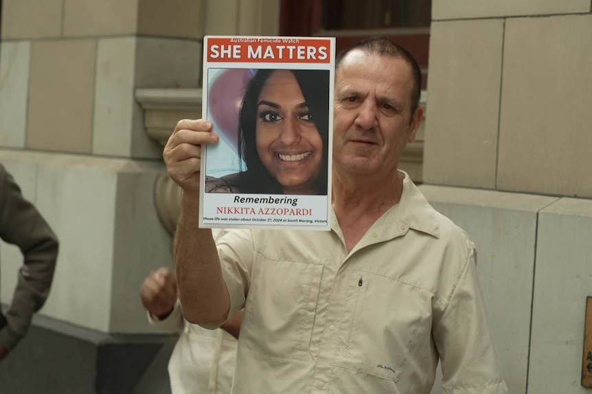 Nikkita Azzopardi's father hold up a photo of his daughter as he speaks to media outside court.