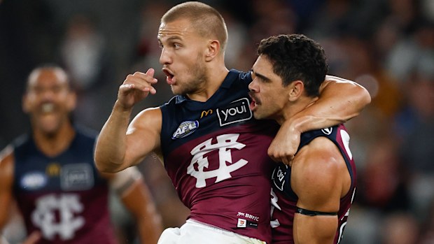 Kai Lohmann (left) and Charlie Cameron of the Lions celebrate.