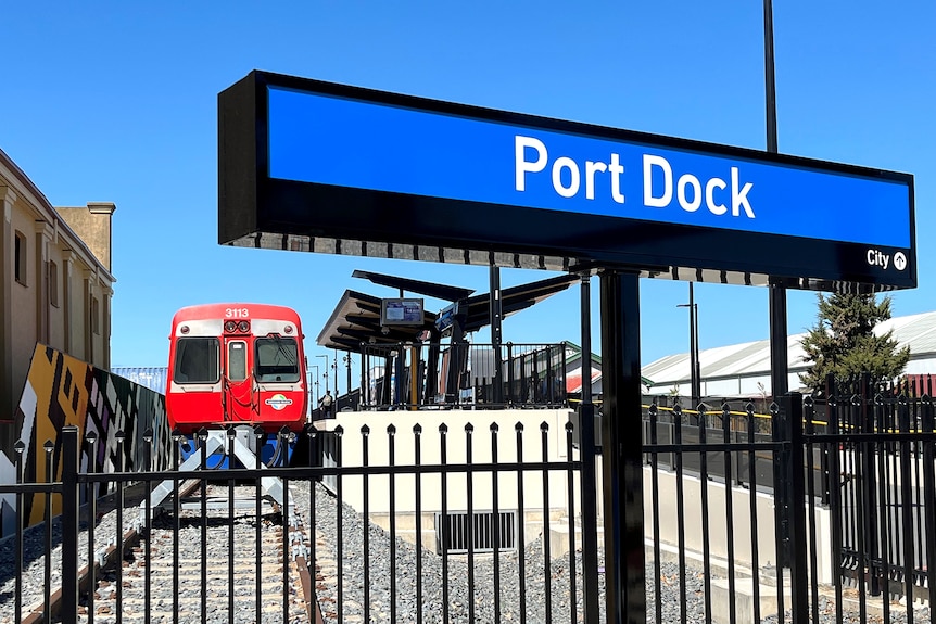 A train at a station named Port Dock