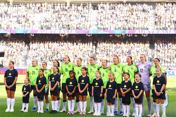 The Matildas sing the national anthem in front of a sold-out crowd in Perth.