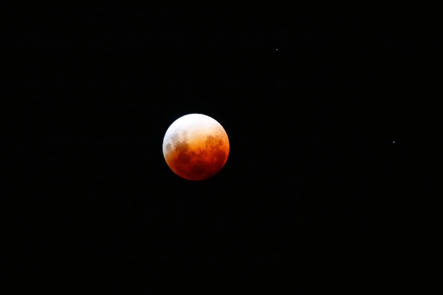 Image of the moon, partially red from the lunar eclipse