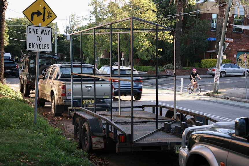 A trailer parked on the kerbside of a road