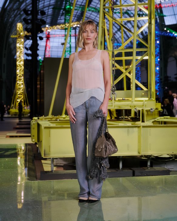 Robbie wears a sheer Chanel ensemble, but it was her hair that turned heads.