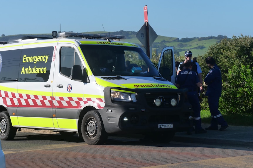 An emergency vehicle with police officers.