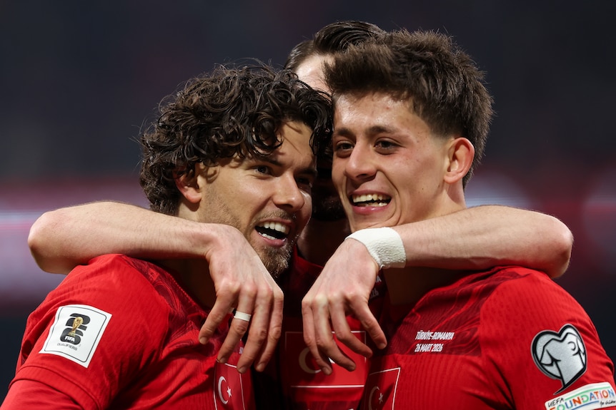 Turkish footballers celebrate a goal