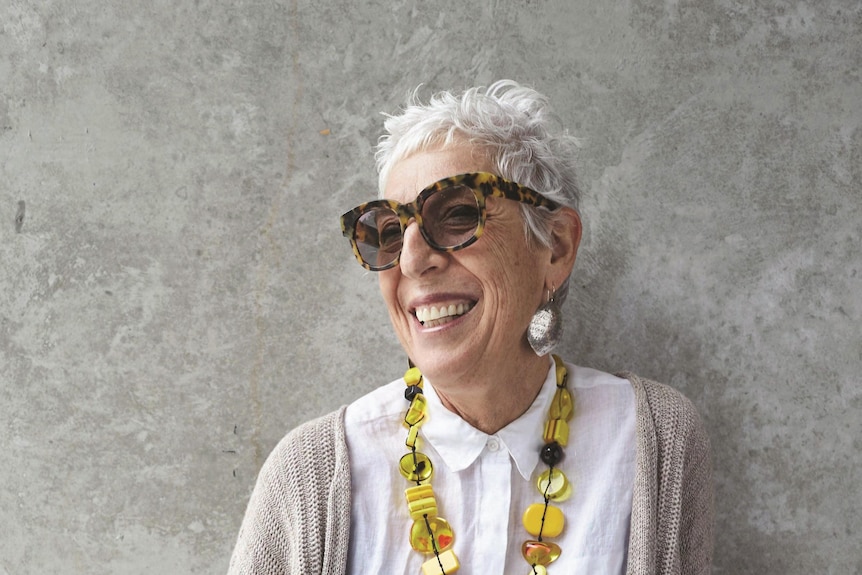 close up of ronni kahn as she looks to the right smiling