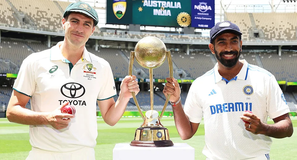 Pat Cummins and Jasprit Bumrah with the Border-Gavaskar Trophy.