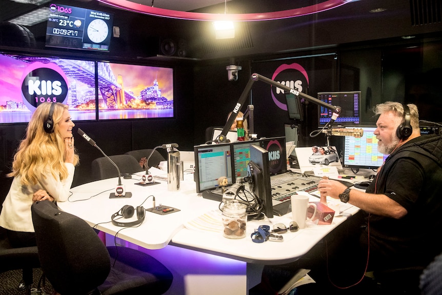 An image of Kyle Sandilands interviewing Paris Hilton in the KIIS FM studios.