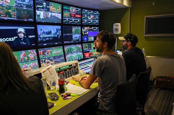 The production team, including director Jarrod Rathjen (centre), juggle the many camera shots during a live broadcast.