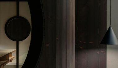 perforated wooden screens filter light and shadow within milan ceramic workshop