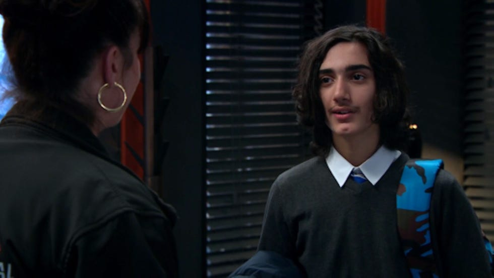 a conversation between two individuals in an indoor setting