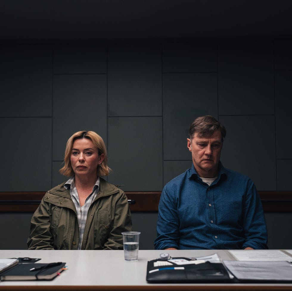 interview setting with two individuals seated at a table interview setting with two individuals seated at a table