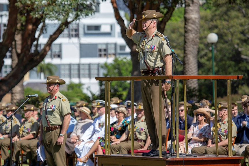 Major General Gus McLachlan giving a salute. 