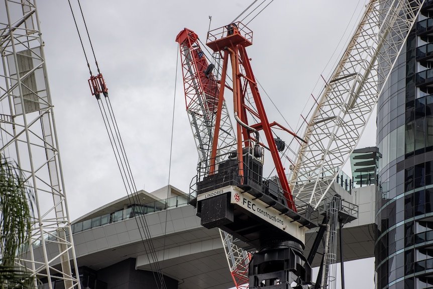 Construction workers in high visibility clothing working on a construction site.