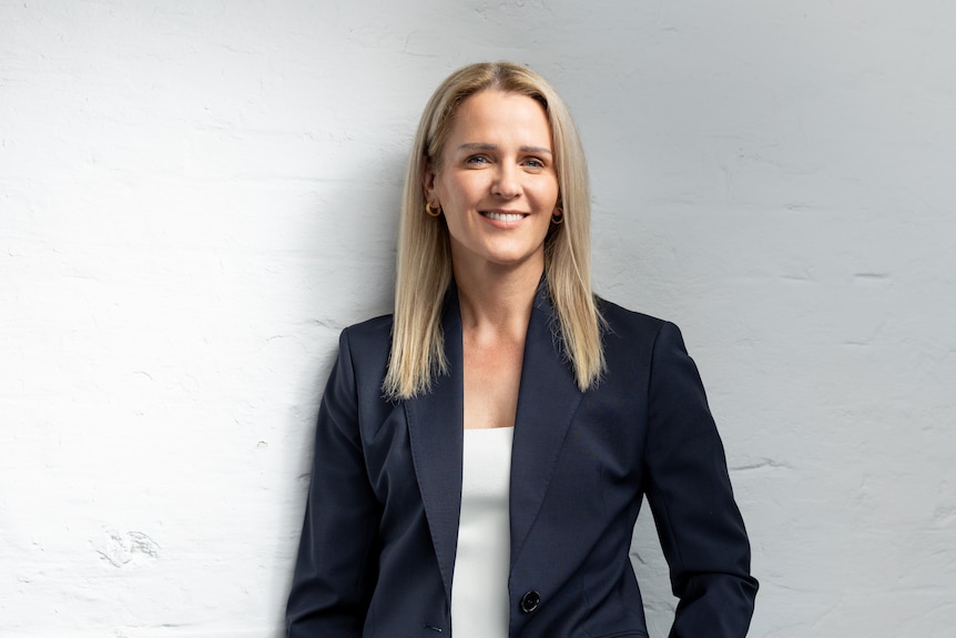 Nerida Conisbee a blonde woman wearing a suit. 