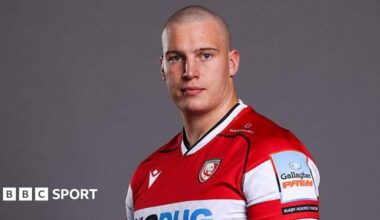 Hugh Bokenham scrambles to his feet with the ball for Gloucester