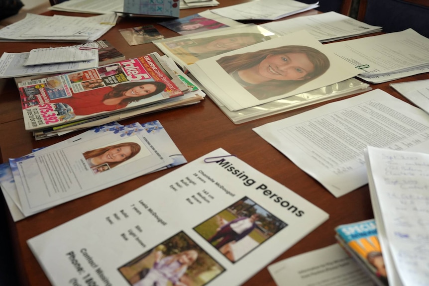 Magazine clippings, newspaper clippings and letters on a table.