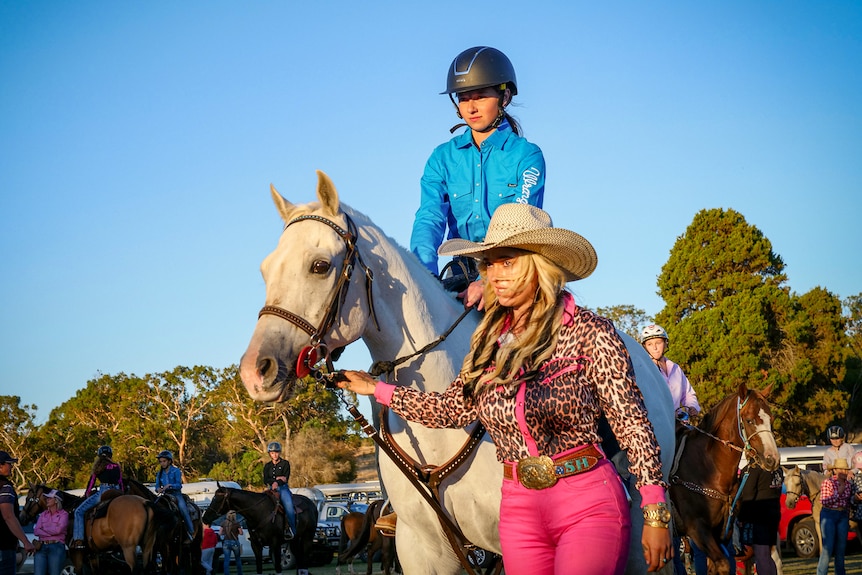Two women with a horse. 