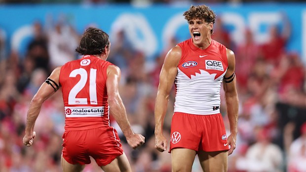 SYDNEY, AUSTRALIA - MARCH 05:  Charlie Curnow of the Swans celebrates with Errol Gulden of the Swans after kicking his first goal during the opening round AFL match between Sydney Swans and Carlton Blues at SCG, on March 05, 2026, in Sydney, Australia. (Photo by Matt King/AFL Photos/via Getty Images)