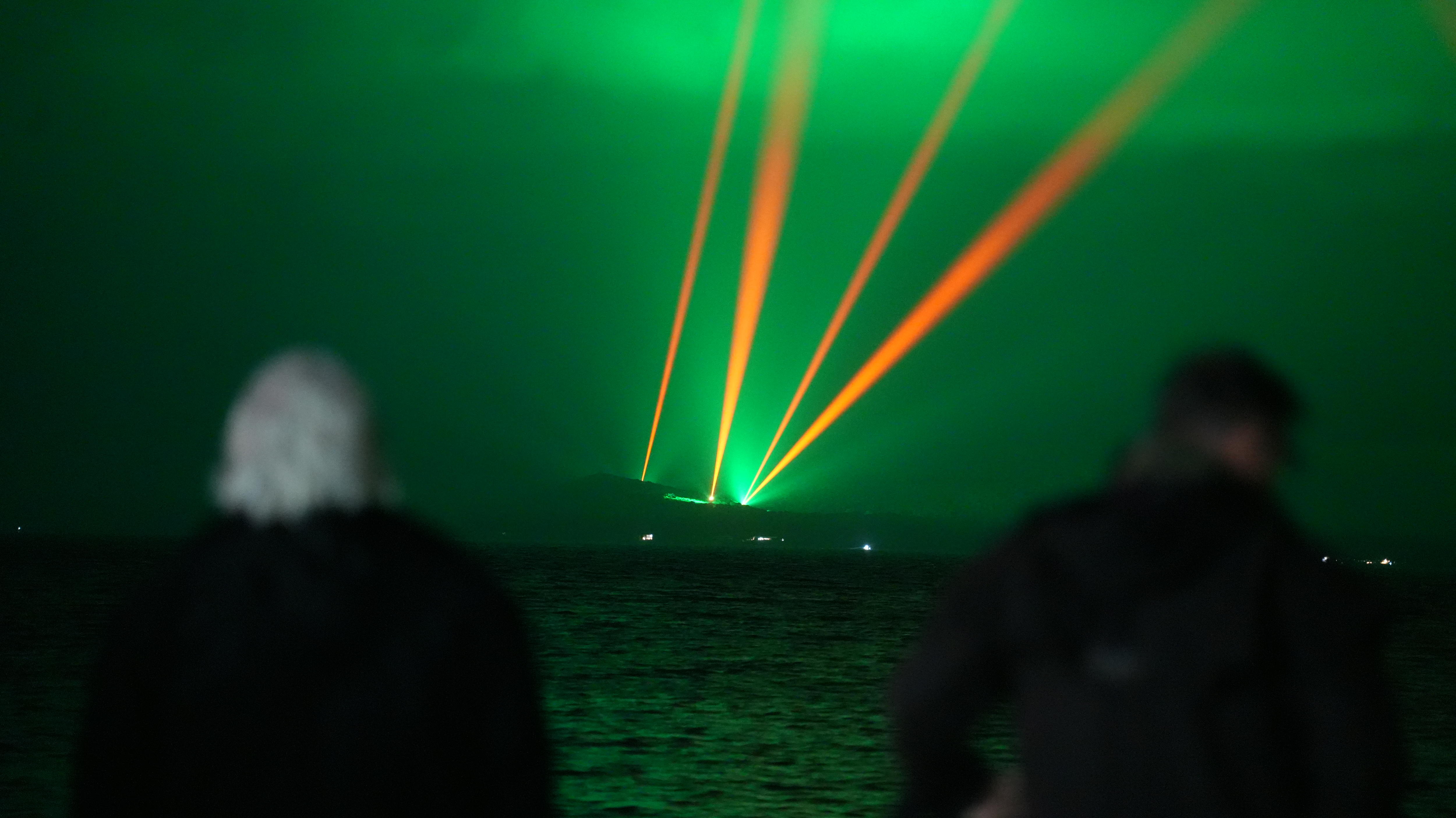 people looking at lights