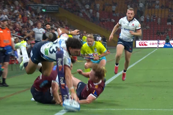 Waratahs winger Triston Reilly dives for the corner. The try was later disallowed by the TMO.