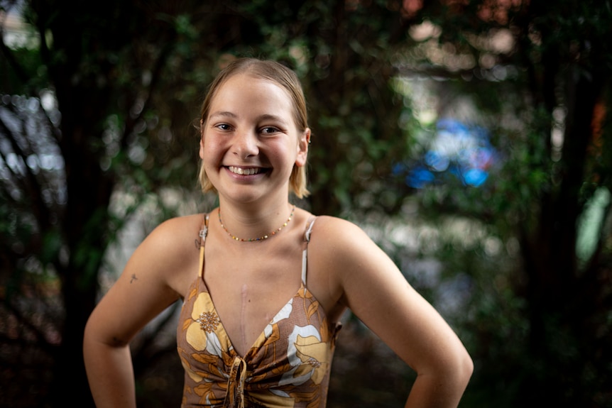 A blonde woman posing for a photo.