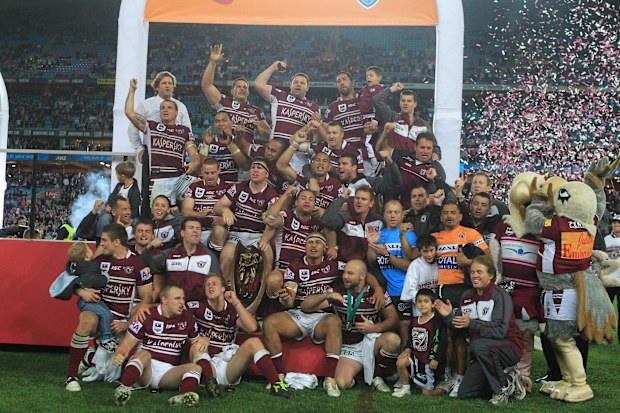 Manly Sea Eagles 2011 grand final team celebrates after being presented the premiership trophy.