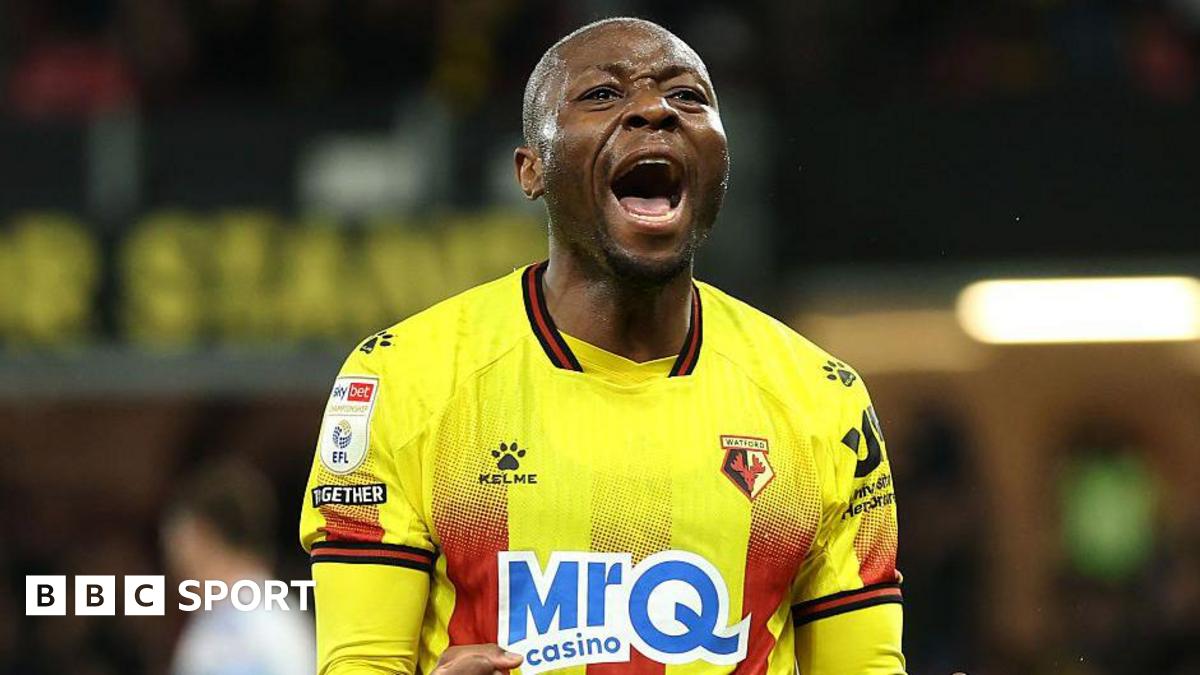 Marc Bola of Watford (centre) celebrates scoring against Wrexham with team-mates Nestory Irankunda (right) and Edo Kayembe (left)