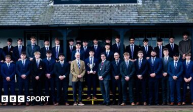 Students and coaches from Northampton School for Boys have their picture taken with the Daily Mail Trophy