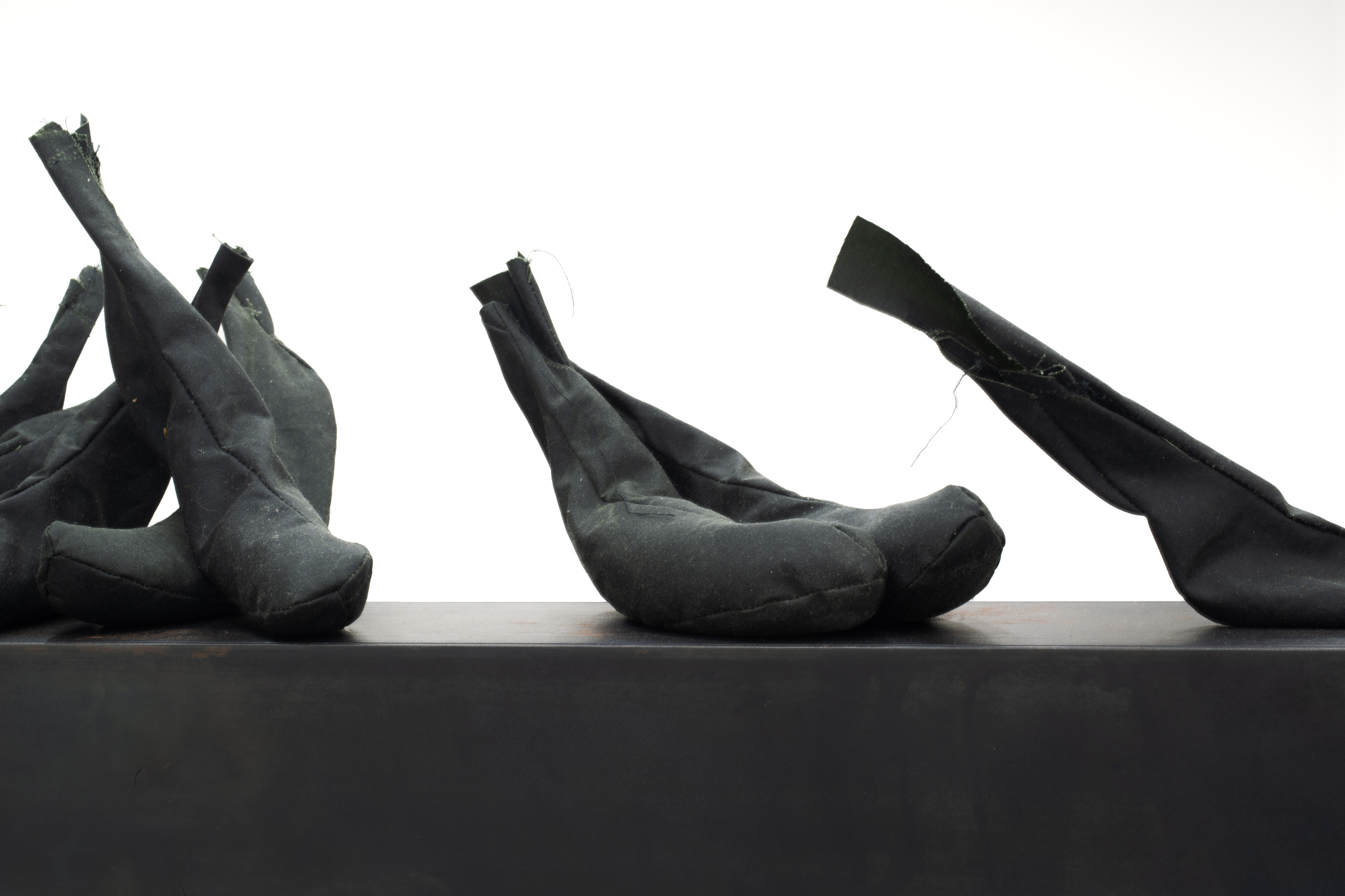 <p>Claire Lambe, <em>Keeping ripe fruit away from eve</em>, 2026, oilskin, sand, and steel, dimensions variable. Photo: Darcy Guttridge</p>