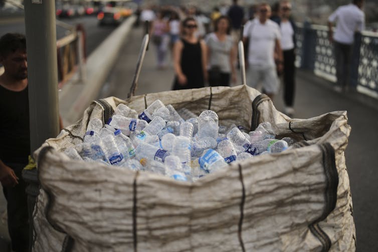 a large bag filled with plastic water bottles
