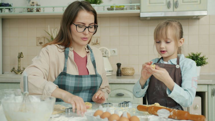 Mother and daughter cooking in the kitchen