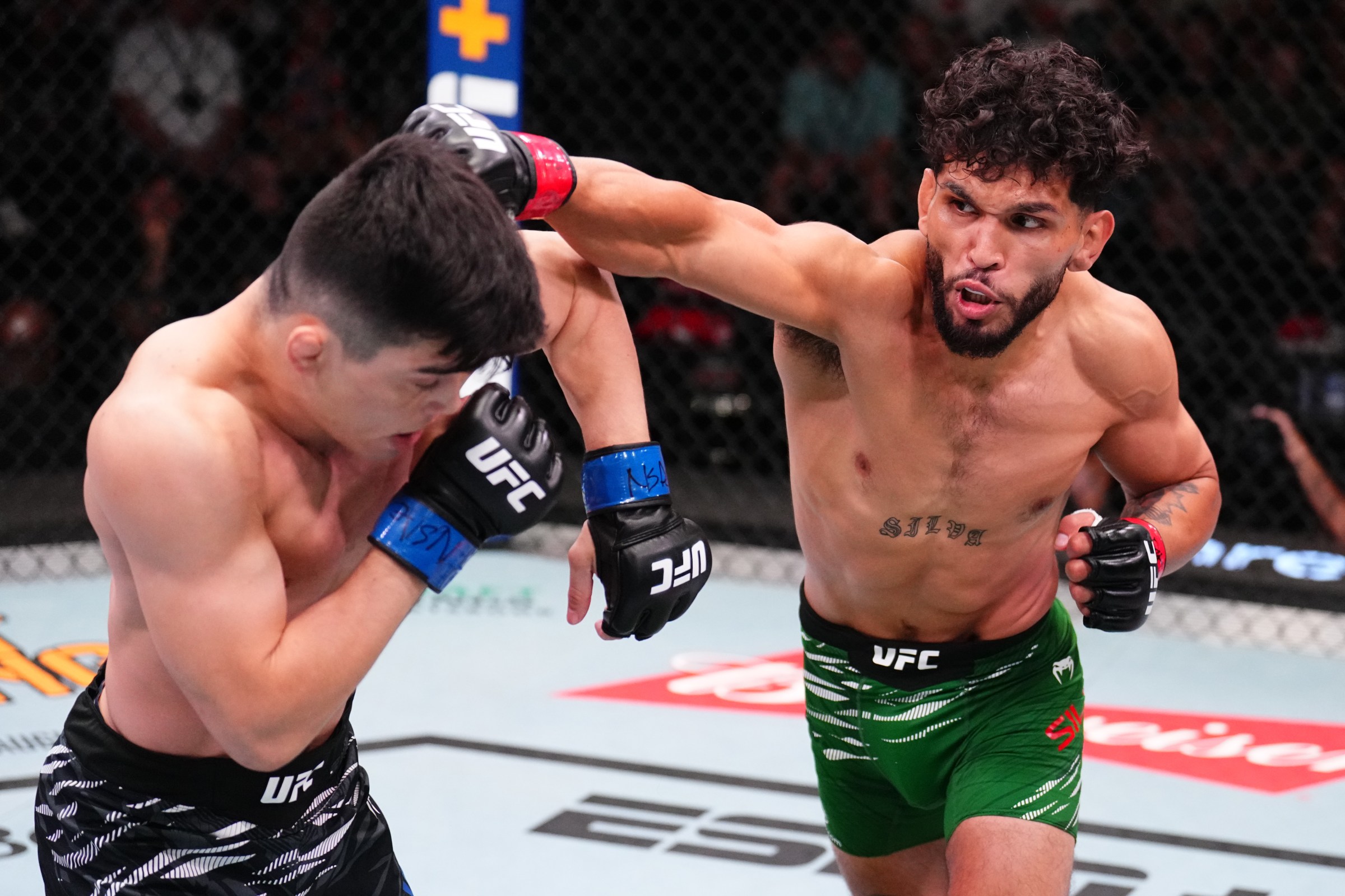 LAS VEGAS, NEVADA - AUGUST 02: (R-L) Danny Silva punches Kevin Vallejos of Argentina in a featherweight fight during the UFC Fight Night event at UFC APEX on August 02, 2025 in Las Vegas, Nevada. (Photo by Chris Unger/Zuffa LLC)